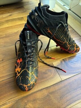 Under Armour Men’s Black and Orange Athletic Cleats